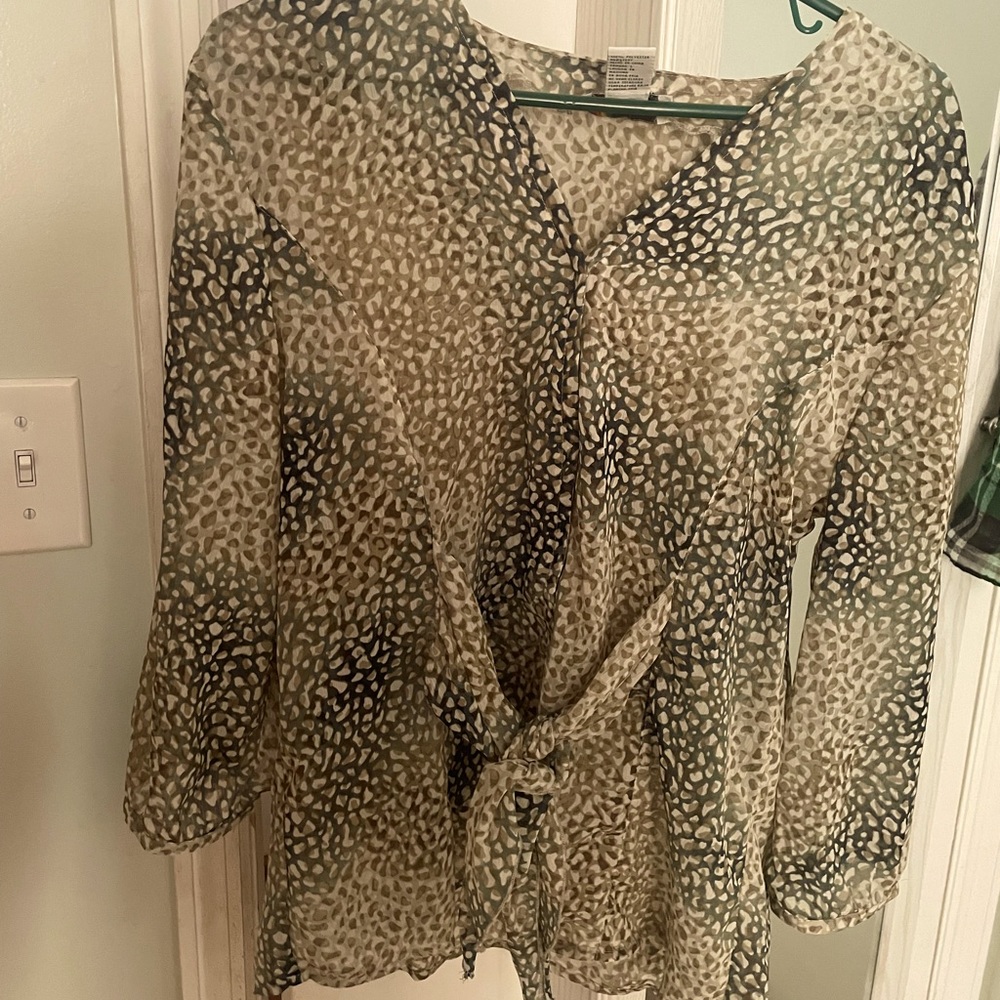 Cute top I have never wore bought it off Poshmark but too small on me .